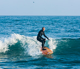Surfing on Punta Roquitas beach